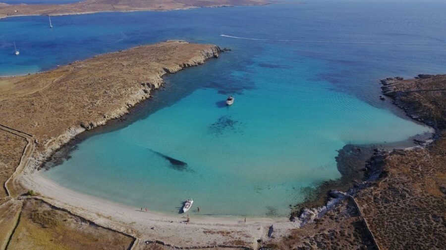 From Ornos: Private Cruise Mykonos to Delos & Rhenia Island - Rhenia and Skinos Blue Laguna: Where the Swimming Becomes the Point