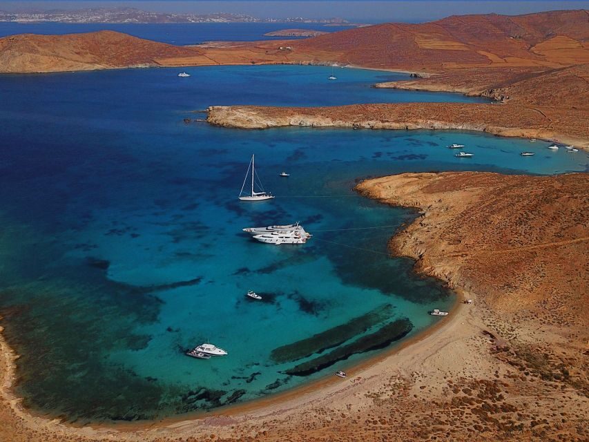 From Ornos: Private Cruise Mykonos to Delos & Rhenia Island - On-Board Comfort on a Private Boat: Snacks, Drinks, and Space to Breathe