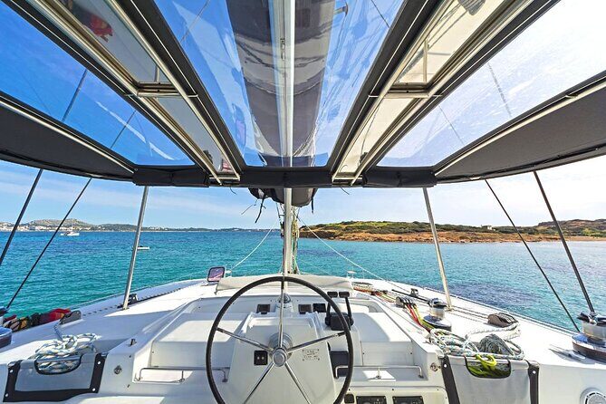 Mykonos Catamaran Premium Day-Sunset Tours 8-flavor Meal & Drinks - First Sail Out: Rhenia, Smooth Cruising, and the Cove Setup