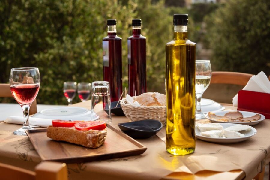 Mykonos: Winery Vineyard Experience with Food & Wine Tasting - The tasting table: organic wine plus Mykonian bites